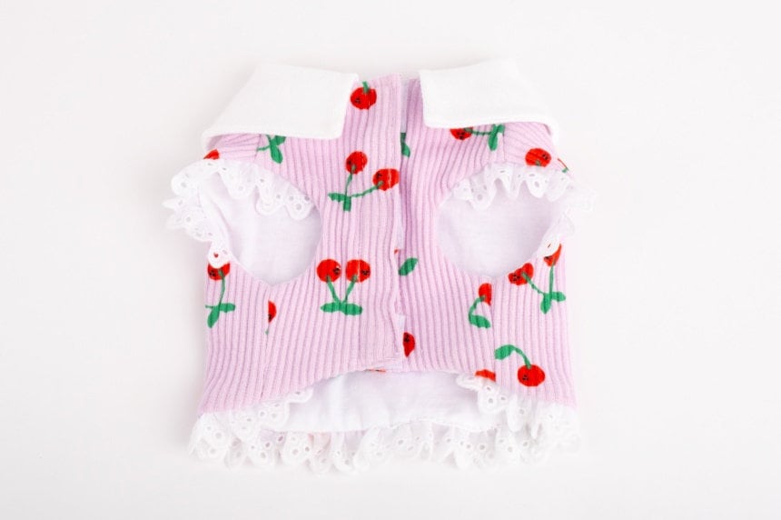 NKpup Cherry Dress Harness in pink ribbed fabric with cherry pattern and white lace trim