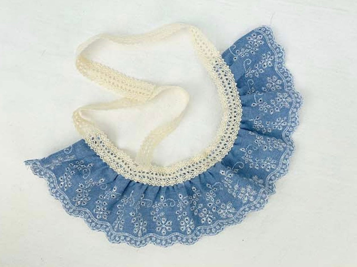Blue denim lace dog cape with white floral embroidery and ruffled edges by NKpup
