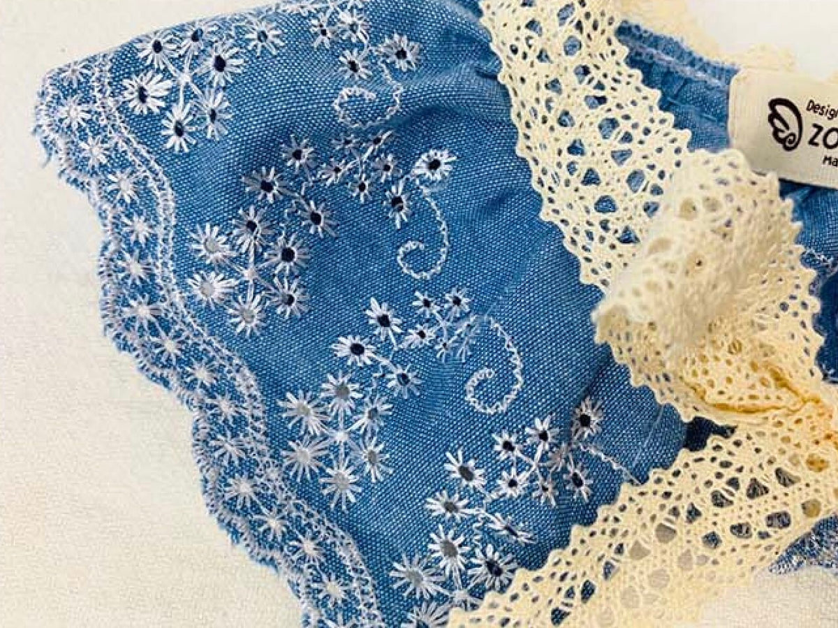 Blue denim lace dog cape with white floral embroidery and cream lace trim by NKpup
