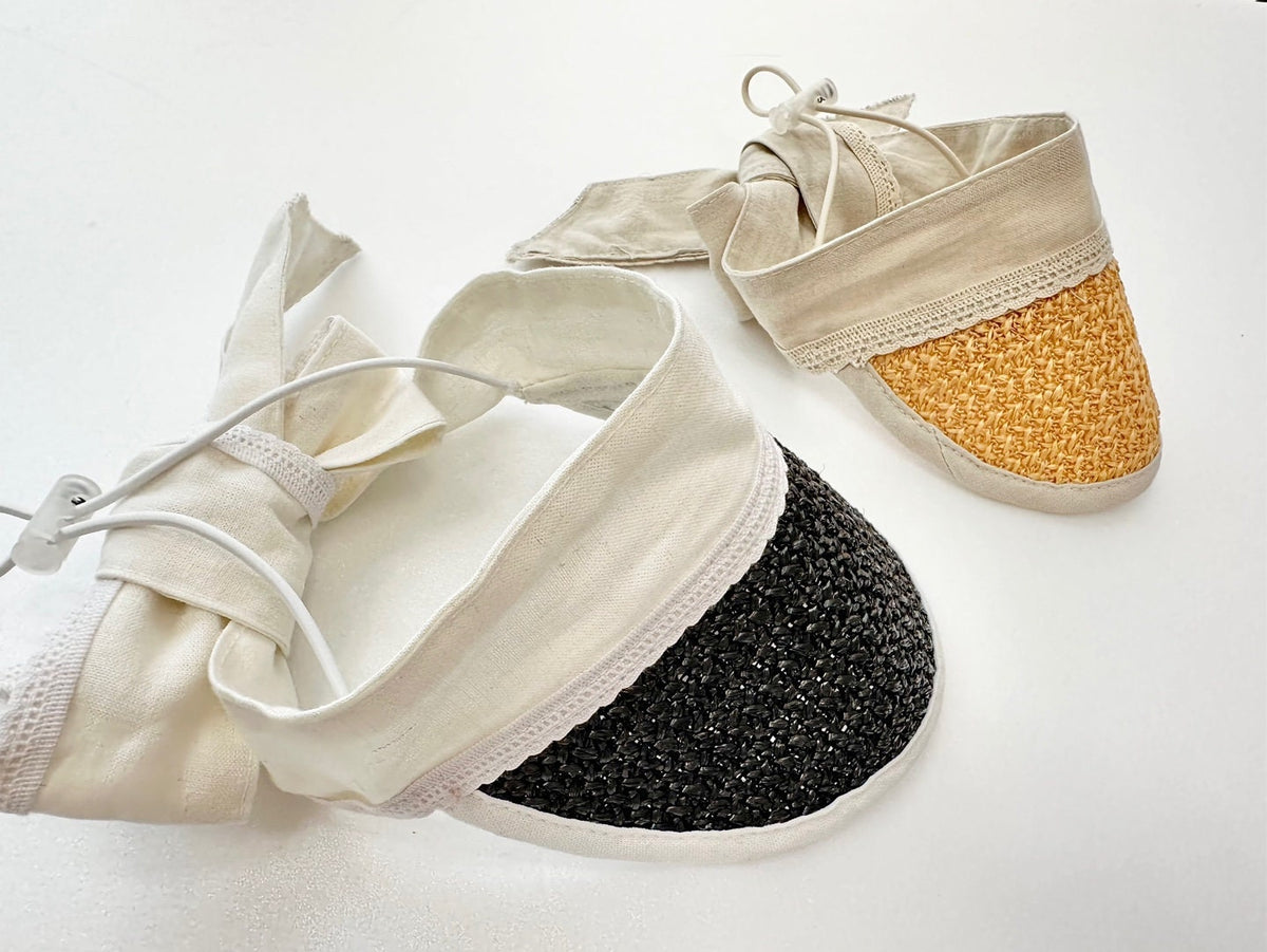 NKpup Charming Straw Sun Hat in cream and black with a tie closure