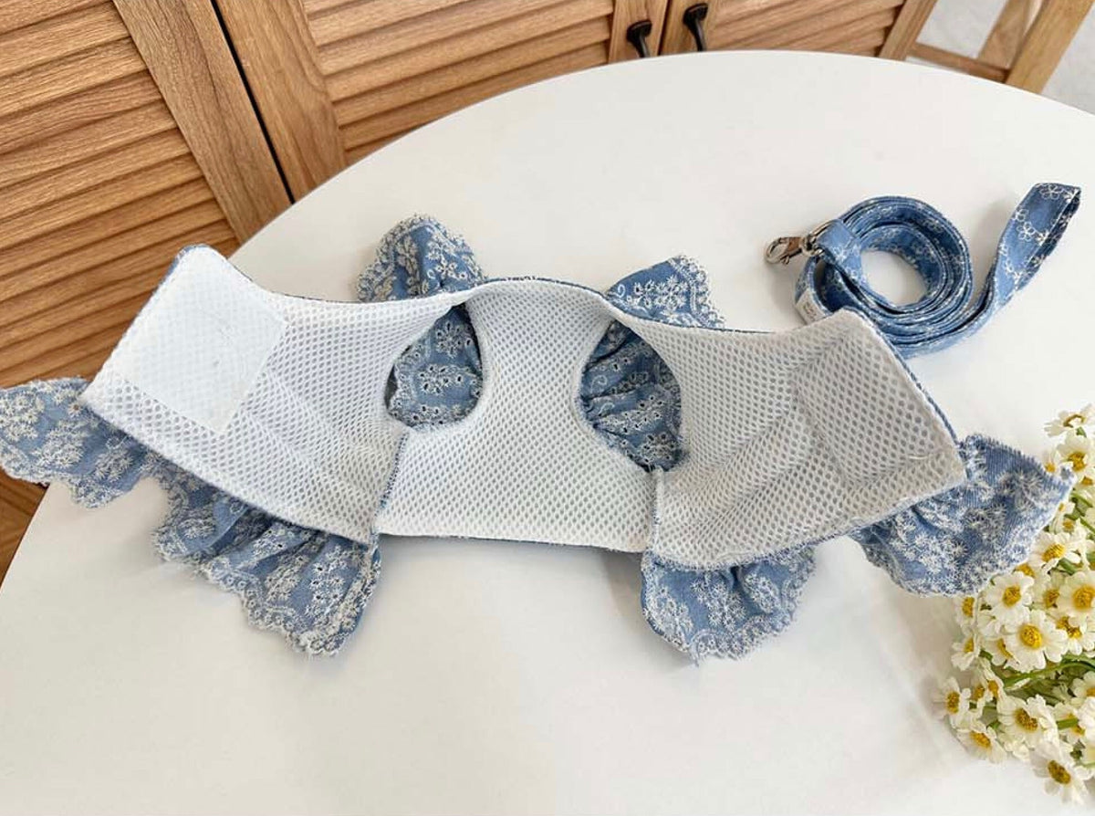 Denim floral pattern dog harness and matching leash set in light blue.