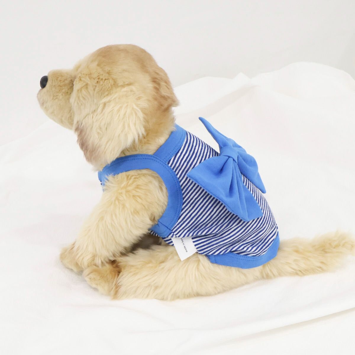 Blue and white striped dog shirt with a large decorative ribbon on the back by NKpup