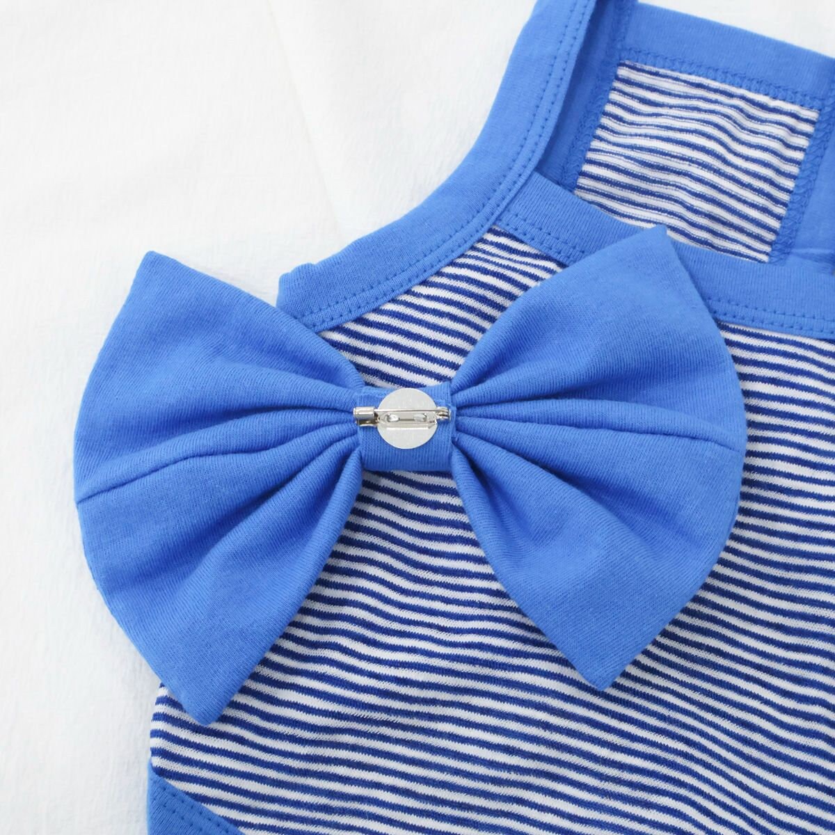NKpup blue and white striped dog shirt with a large blue ribbon bow detail.