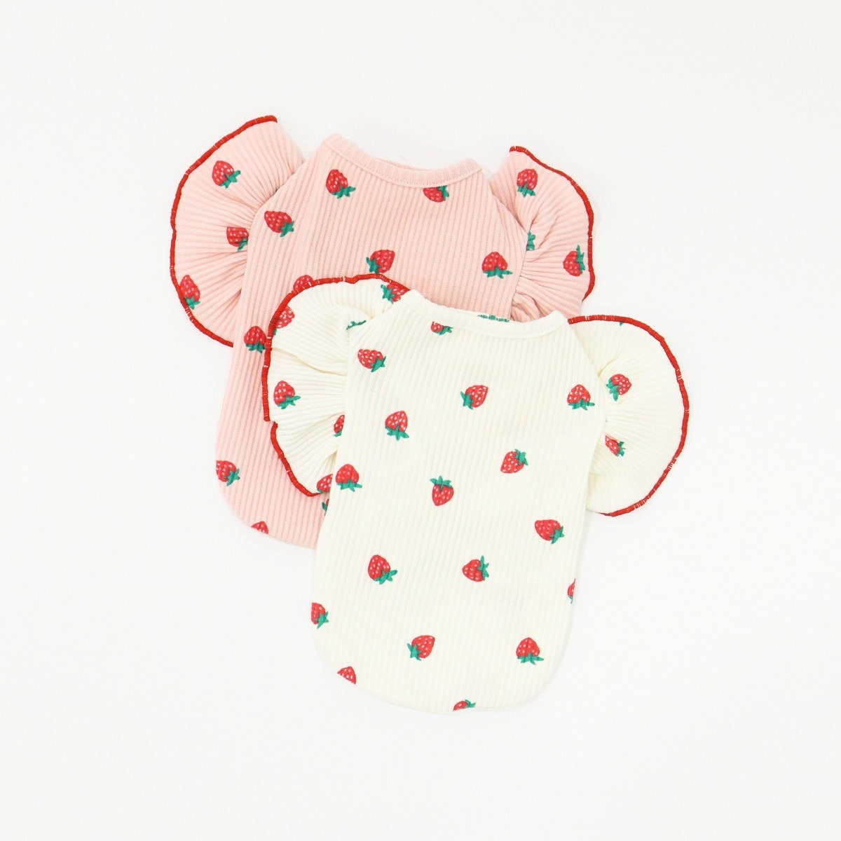 NKpup strawberry print dog shirts with ruffle sleeves in pink and white.