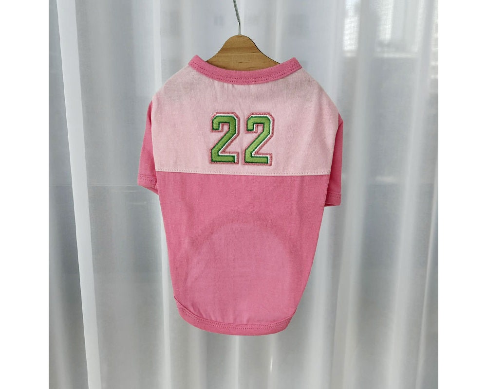 NKpup pink color-block dog shirt featuring a green number 22 on the back