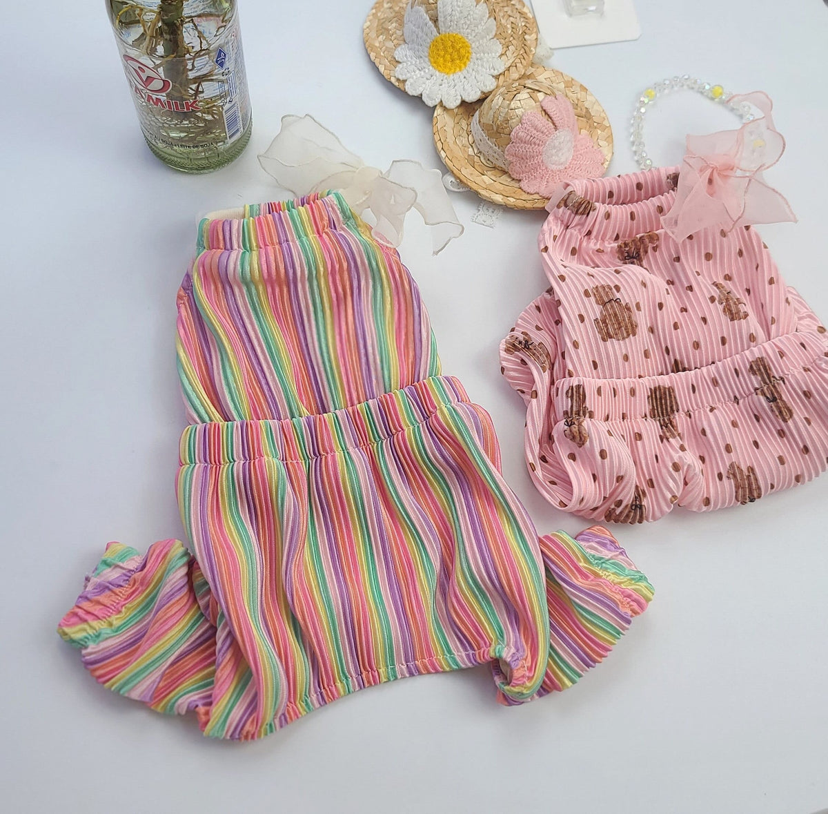 Bali Ribbon Dog Overall in rainbow stripes and pink polka dot patterns