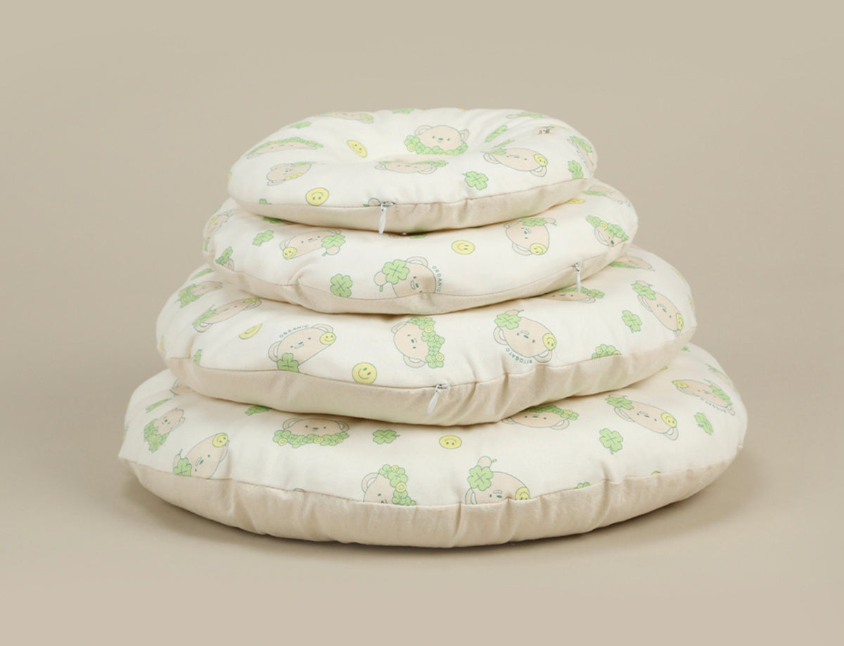 Stack of GOTS organic cotton cushion collars for pets with cute dog illustrations