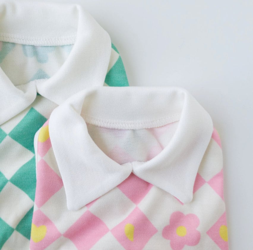NKpup checkerboard flower dog shirt in pink and white with a white collar
