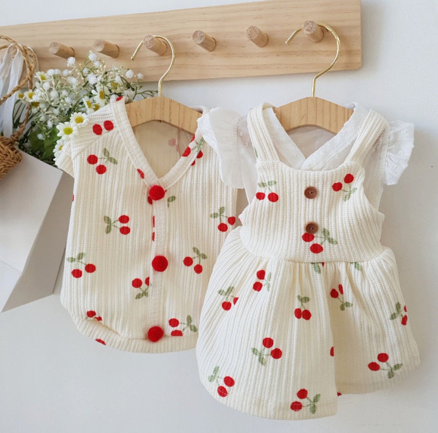 NKpup Cherry Cardigan-Style Dog Shirt and matching cherry print dog dress in cream corduroy.