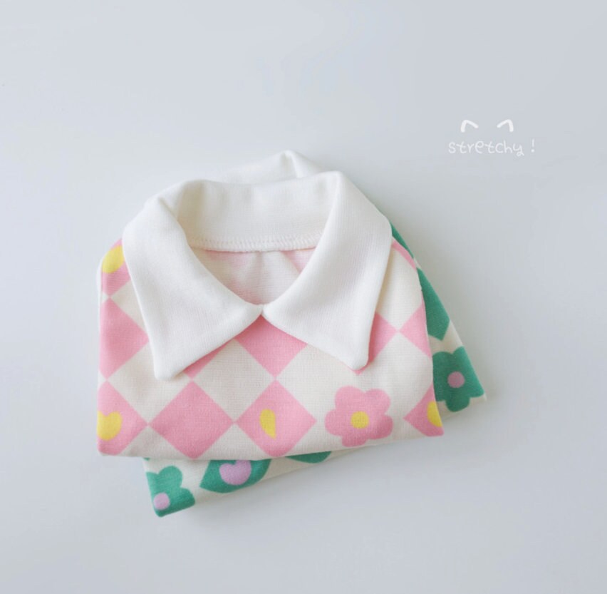 NKpup Checkerboard Flower Dog Shirt in pink and white with green floral pattern