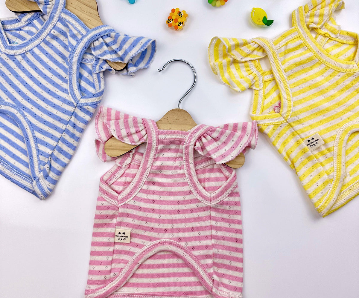 Three NKpup Ice-Cream Eyelet Top pet shirts in blue, pink, and yellow with striped patterns and ruffle sleeves.