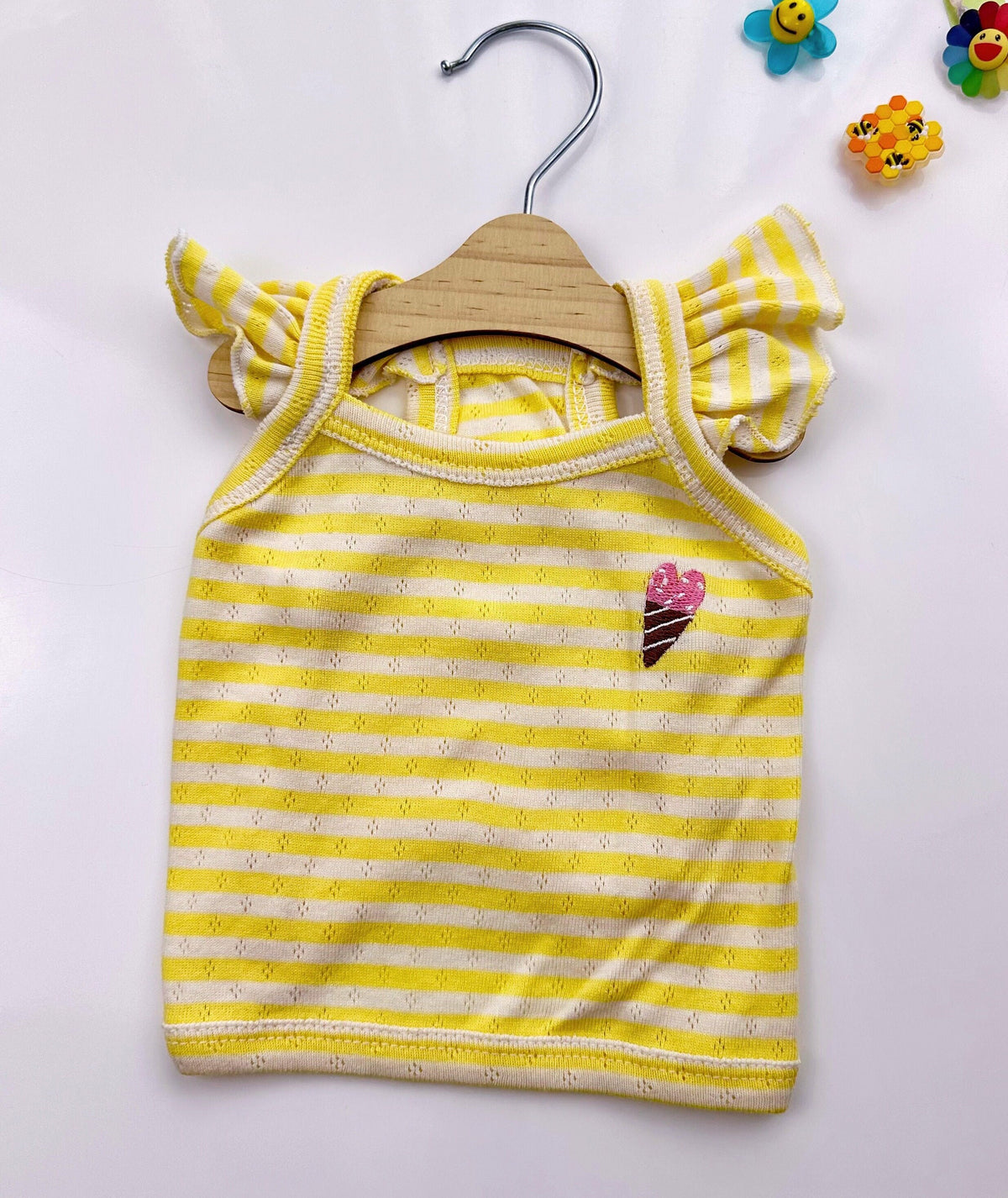 Yellow and white striped Ice-Cream Eyelet Top dog shirt with ruffle sleeves and ice cream patch.
