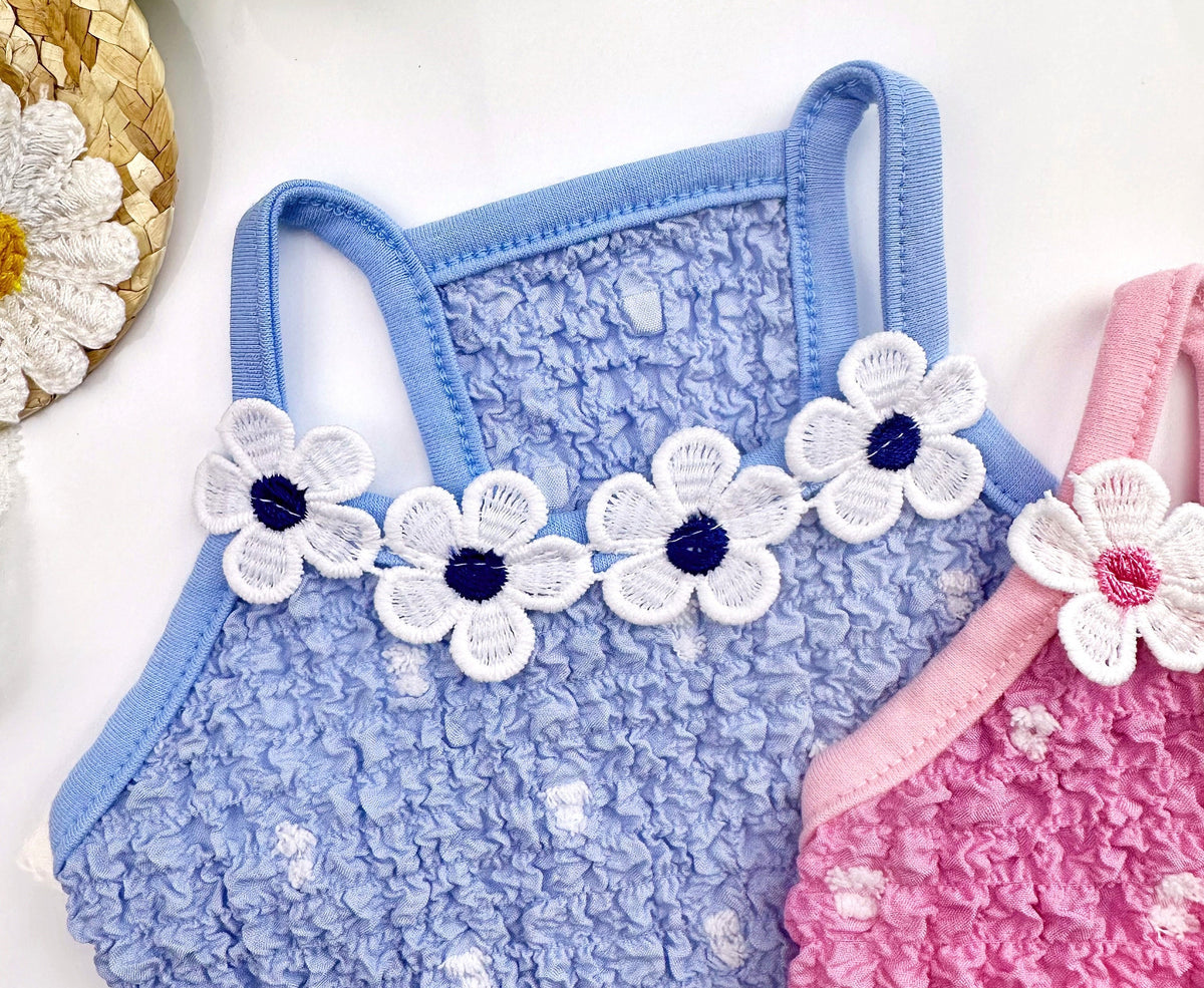 NKpup Daisy Ruffle Dress in light blue with white floral applique and polka dot pattern