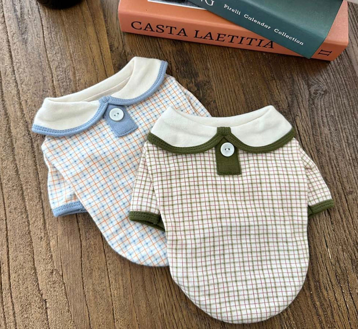 Two plaid collar shirts for dogs, one in blue and one in green and beige.