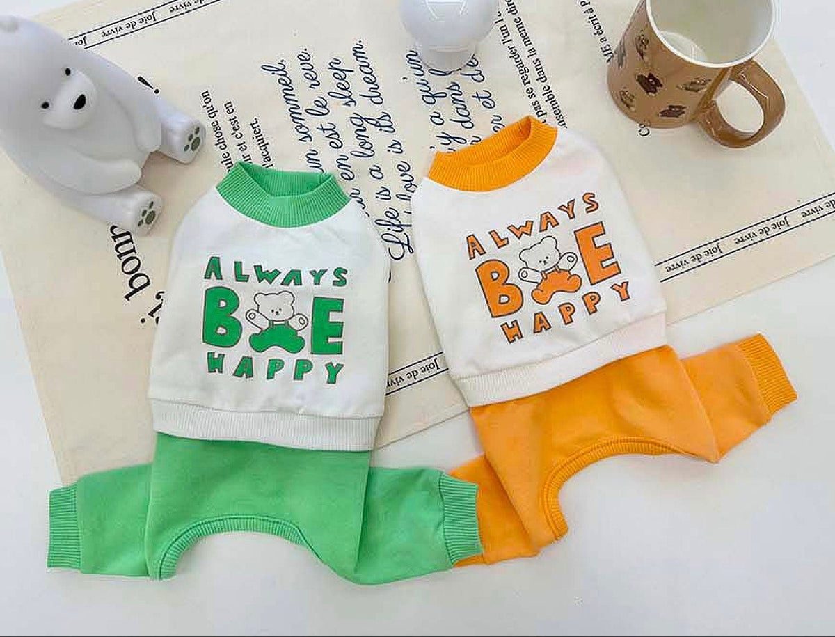 Always Be Happy Dog Overall in white, green, and orange colors with graphic text and bear motifs.