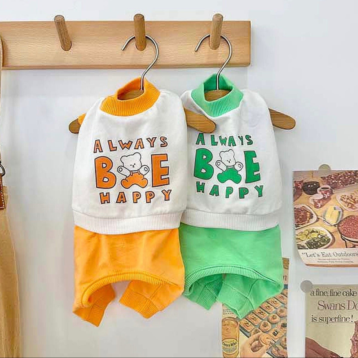 Always Be Happy dog overall in orange and green with bear graphic print.