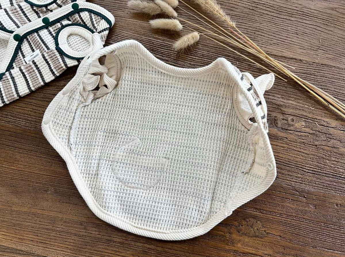 Cream waffle stripe dog vest with decorative button details