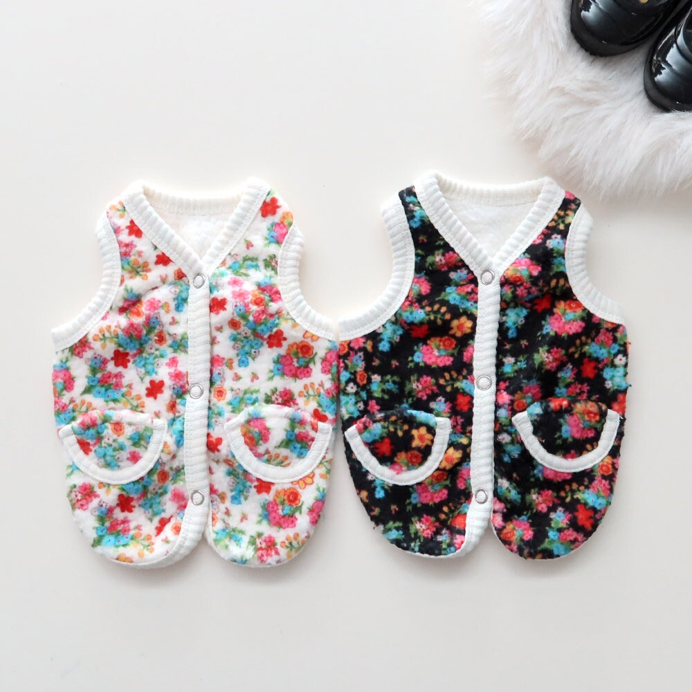 NKpup floral boa fleece dog vests in white and black patterns with front pockets.