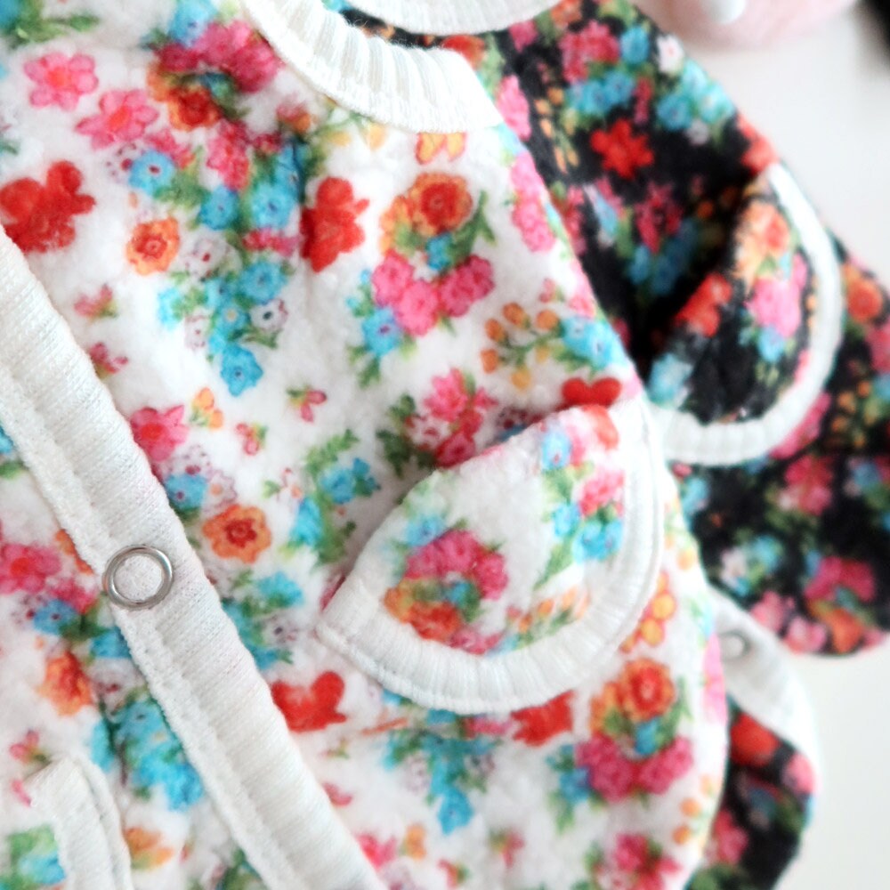 NKpup Floral Boa Fleece Dog Vest with colorful flower patterns and white trim.
