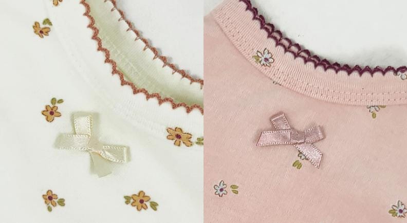 Close-up of floral scalloped overall details in white and pink with bow accents.