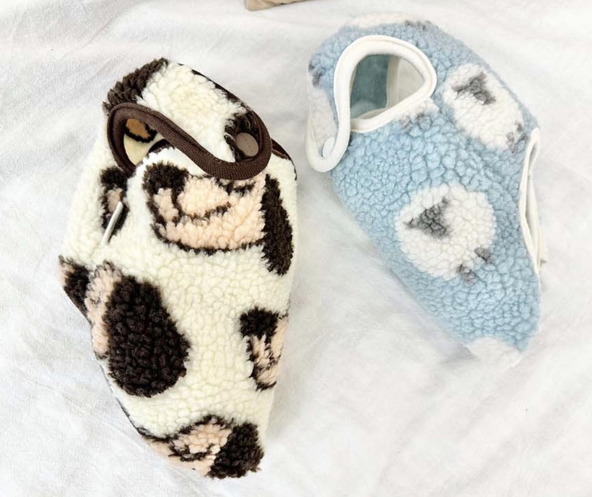 Animal fleece dog sleep vest in white and light blue patterned sherpa fabric