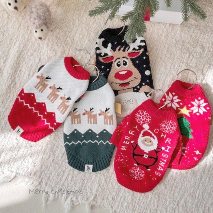 Assorted NKpup Santa knit dog sweaters featuring reindeer, Santa Claus, and Christmas tree patterns.