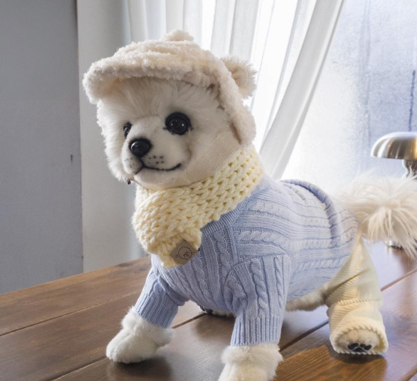 Light blue NKpup cable polo knit dog sweater with a cream-colored knit hat and scarf set