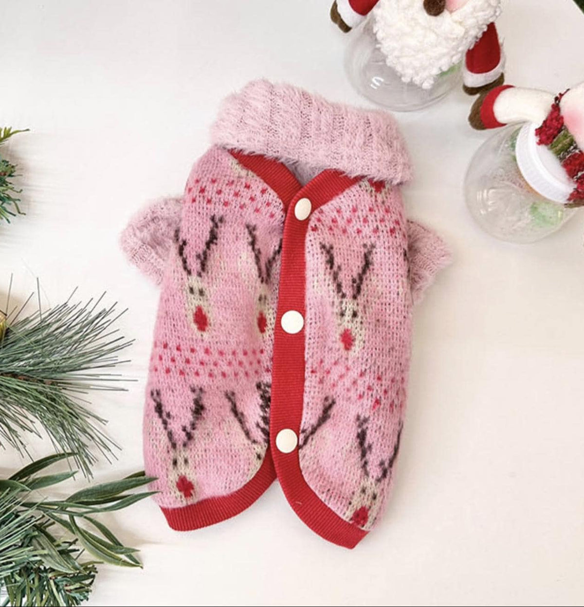 Pink Christmas reindeer knit dog vest with red trim and buttons