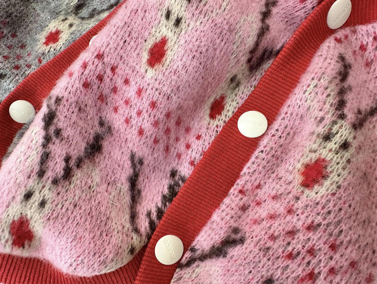 Pink Christmas reindeer knit dog vest with red trim and white buttons
