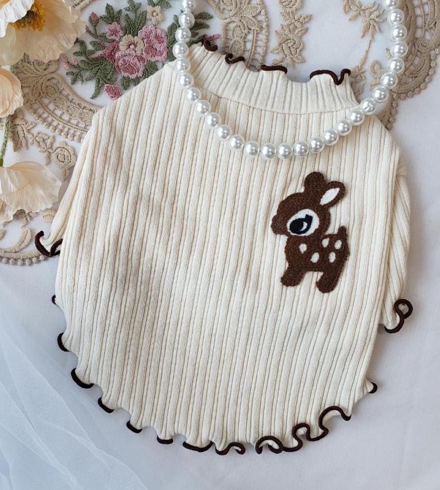 NKpup Frilly Deer Ribbed Tee dog shirt in cream with brown deer embroidery and ruffled edges