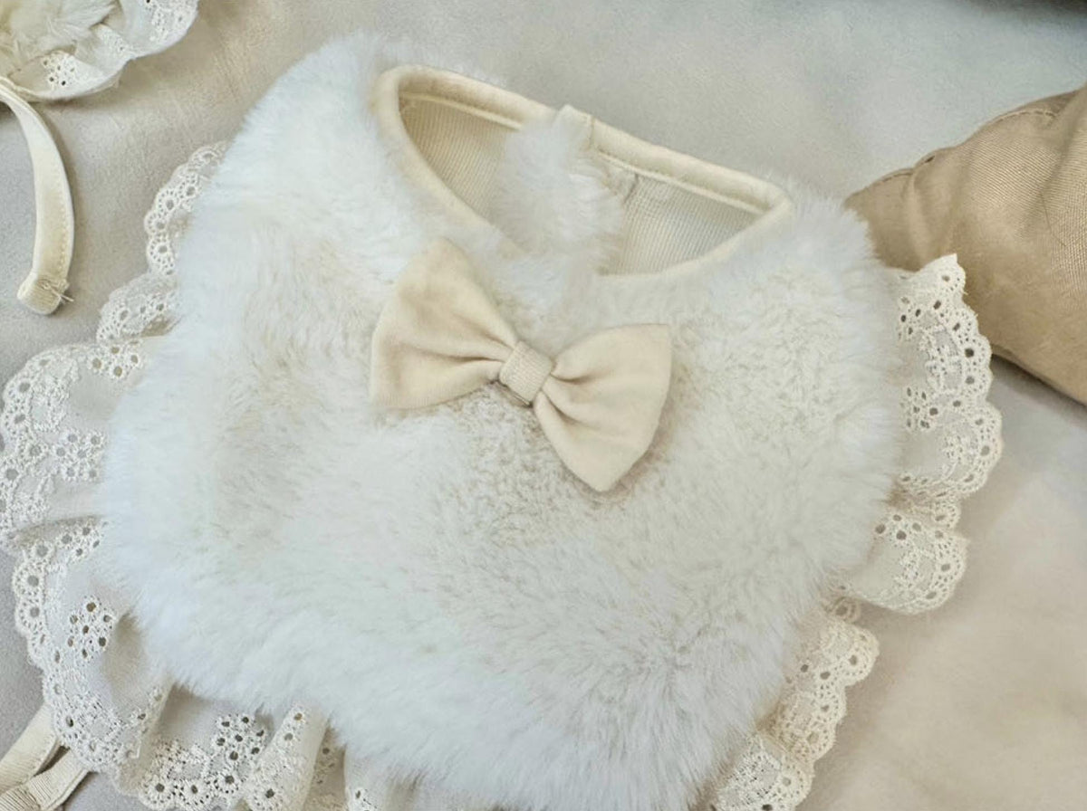 White mink fleece dog bib and cape with lace trim and a cream bow