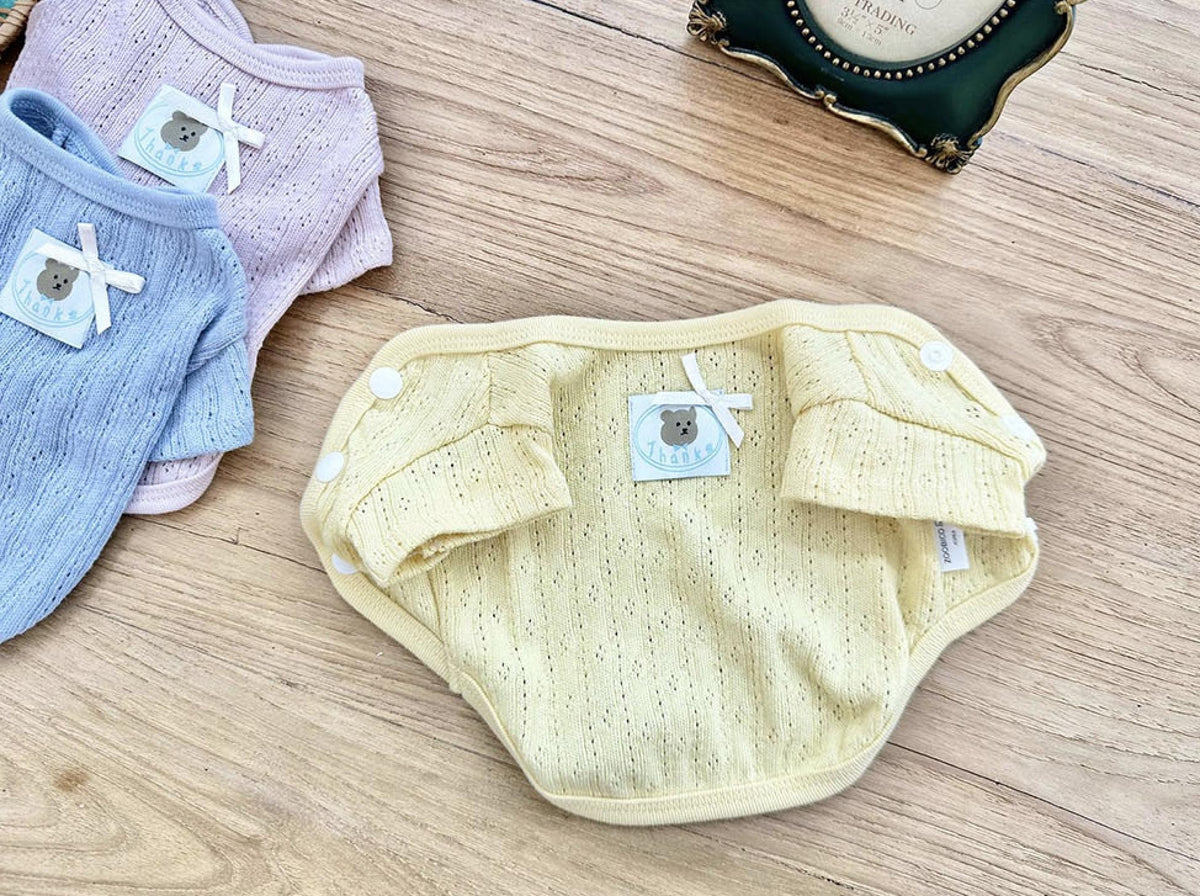 Vicky Eyelet Dog Cardigan in pale yellow with ruffle sleeves and button details