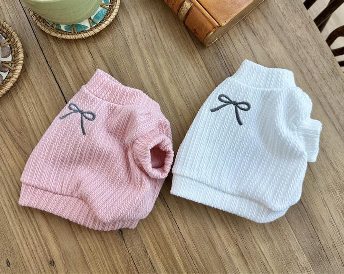 Pink and white NKpup eyelet crop top dog shirts with small bow accents