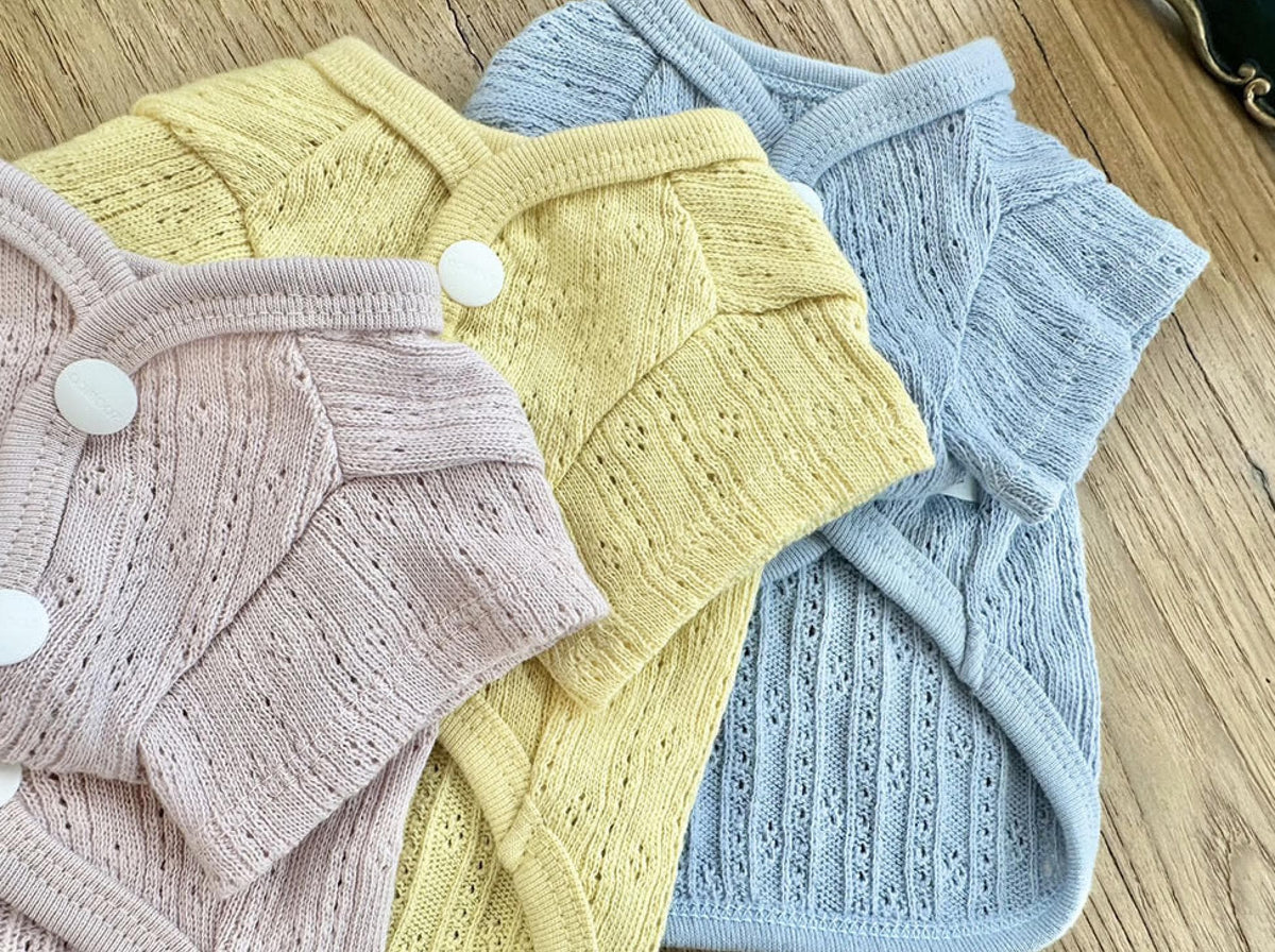 Vicky Eyelet Dog Cardigan in pink, yellow, and light blue knit fabric