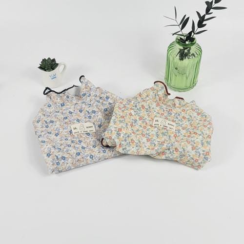 Blossom Ruffle Dog Shirt with floral pattern in blue and orange tones