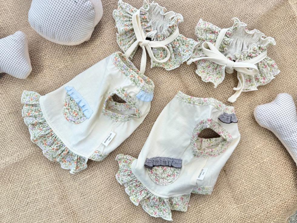 Floral ruffle dog dress set in white with light blue and grey accents.