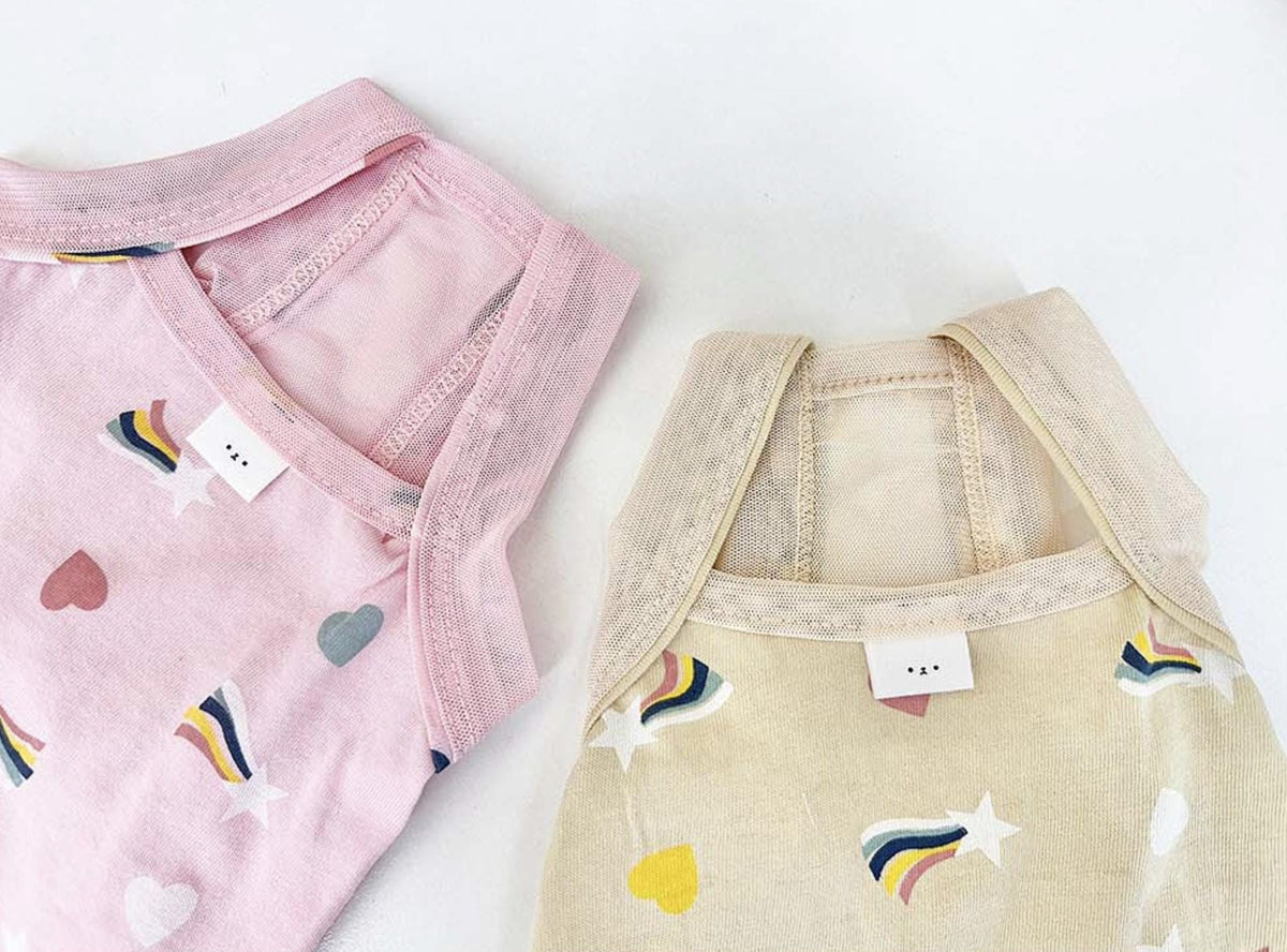 Rainbow print dog dresses in pink and beige with heart and star patterns by NKpup