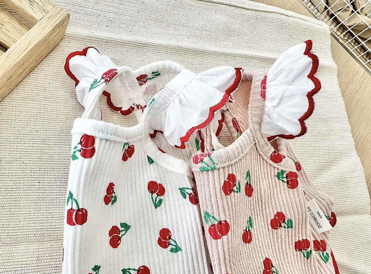 White and pink NKpup cherry frill ribbed dog shirts with red scalloped edges