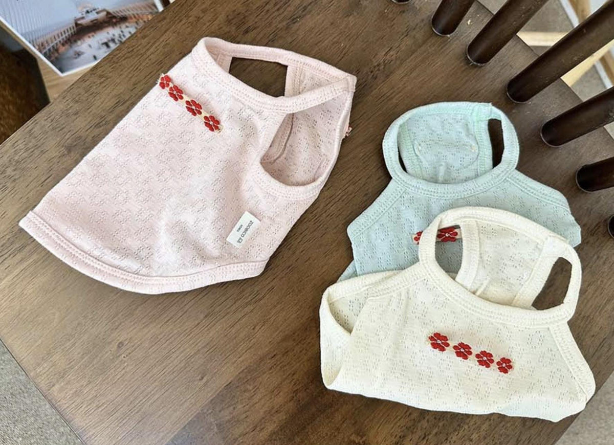 NKpup Eyelet Floral Tank Top dog shirts in pink, mint, and cream with red floral embroidery.