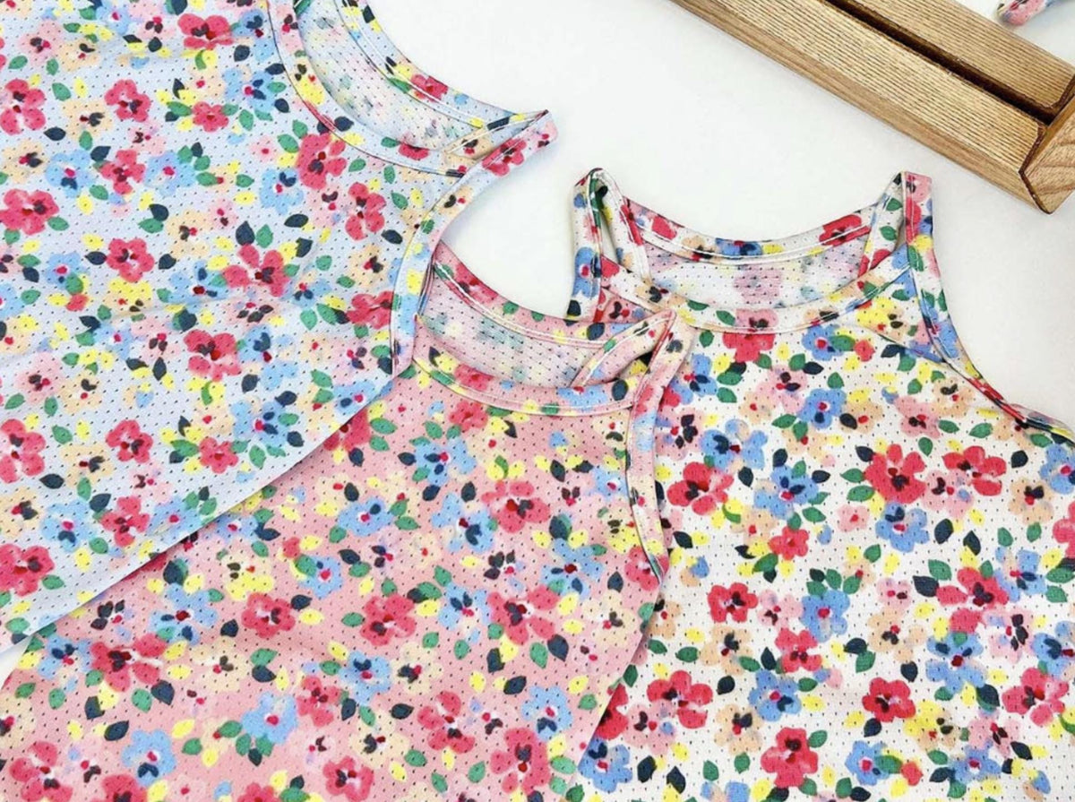 Floral pattern cooling mesh dog shirts in pink and white colors.