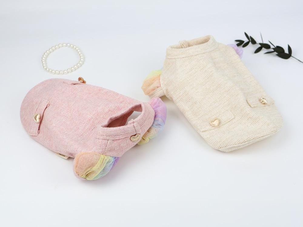NKpup Rainbow Puff Dog Cardigans in pink and cream with pastel rainbow puff sleeves.