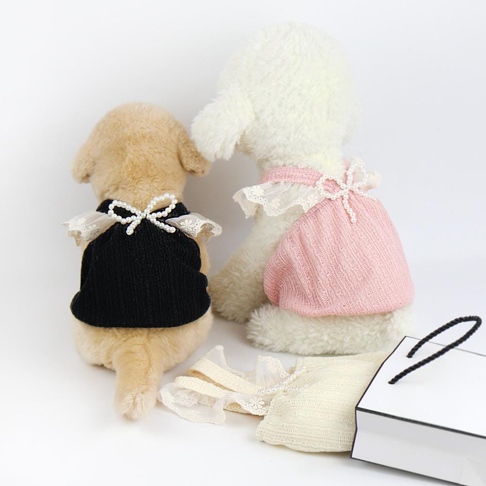 NKpup Pearl Ruffle Tops for dogs in black and pink with lace ruffles and pearl bow details.