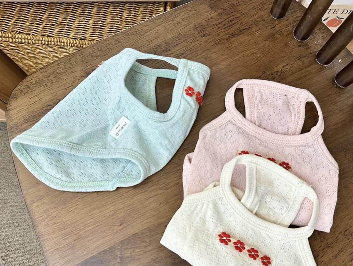 NKpup Eyelet Floral Tank Top dog shirts in mint, pink, and cream colors.