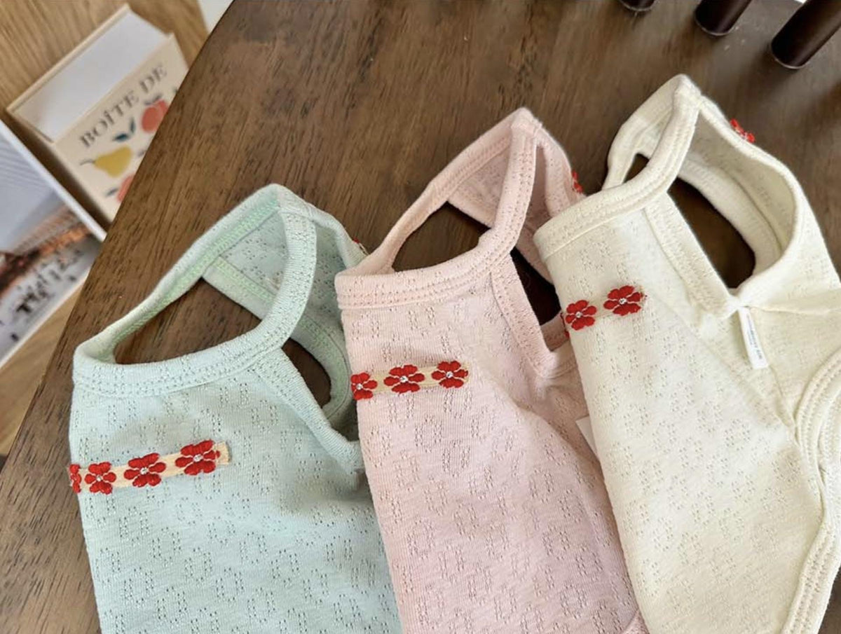 Three NKpup eyelet floral tank tops for dogs in mint green, light pink, and cream.