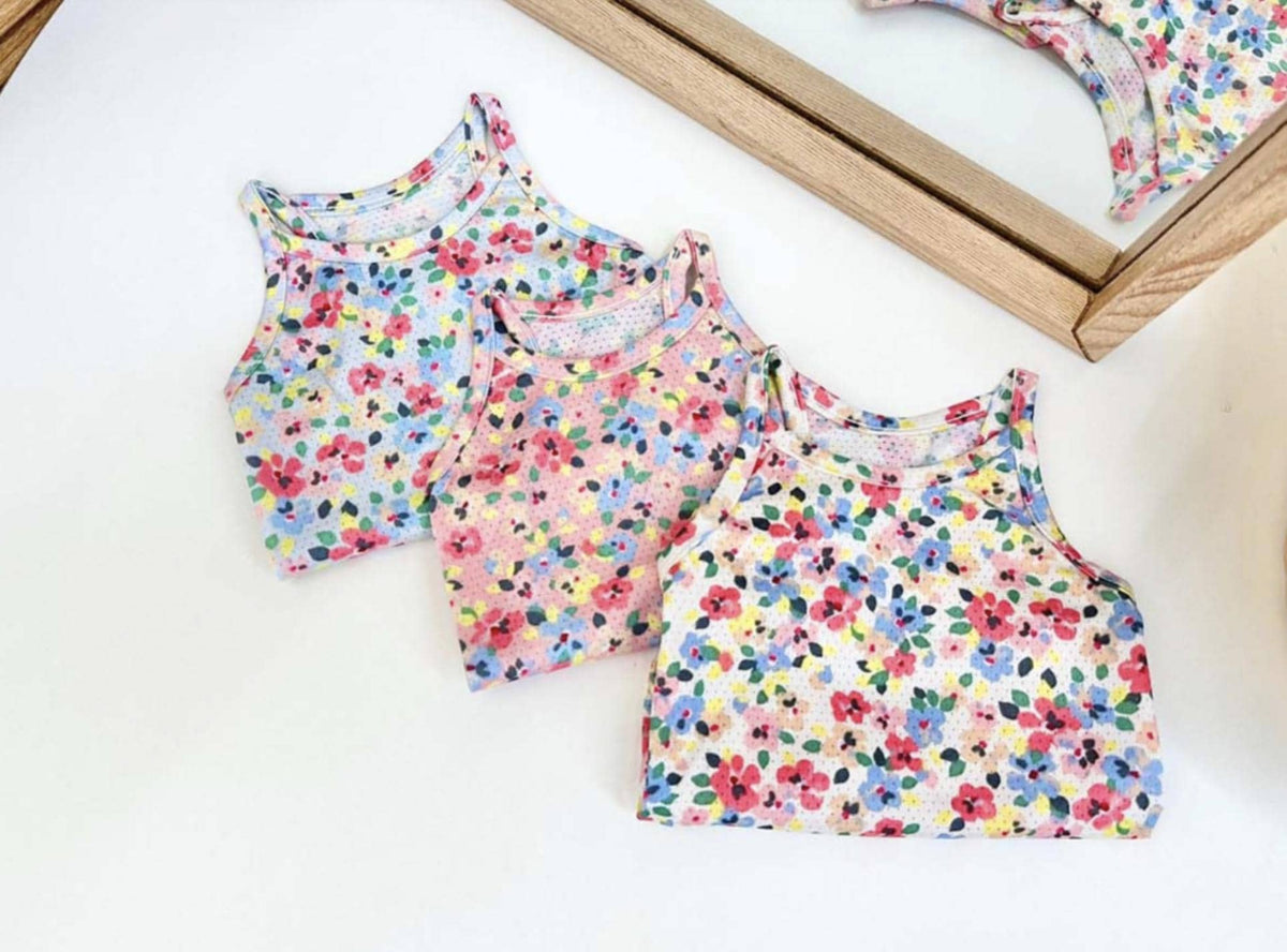 Three NKpup floral cooling mesh dog tops in pink, blue, and yellow patterns.