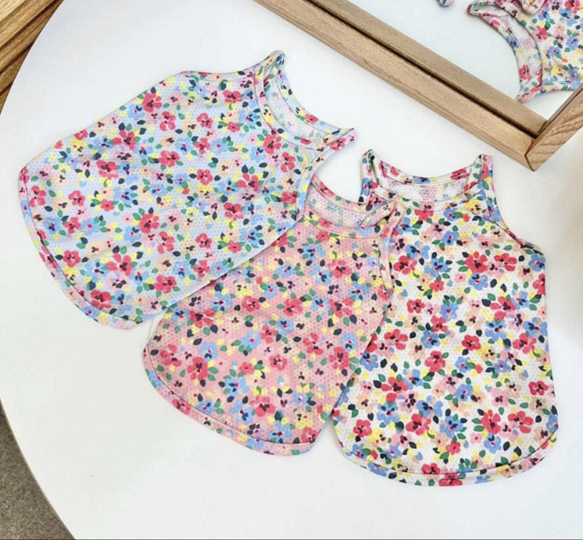 Three NKpup floral cooling mesh tops for dogs in colorful floral patterns