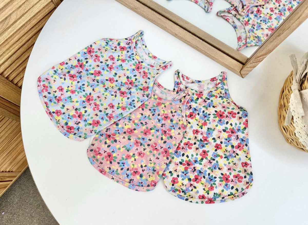 Three NKpup floral cooling mesh tops for dogs in colorful floral patterns