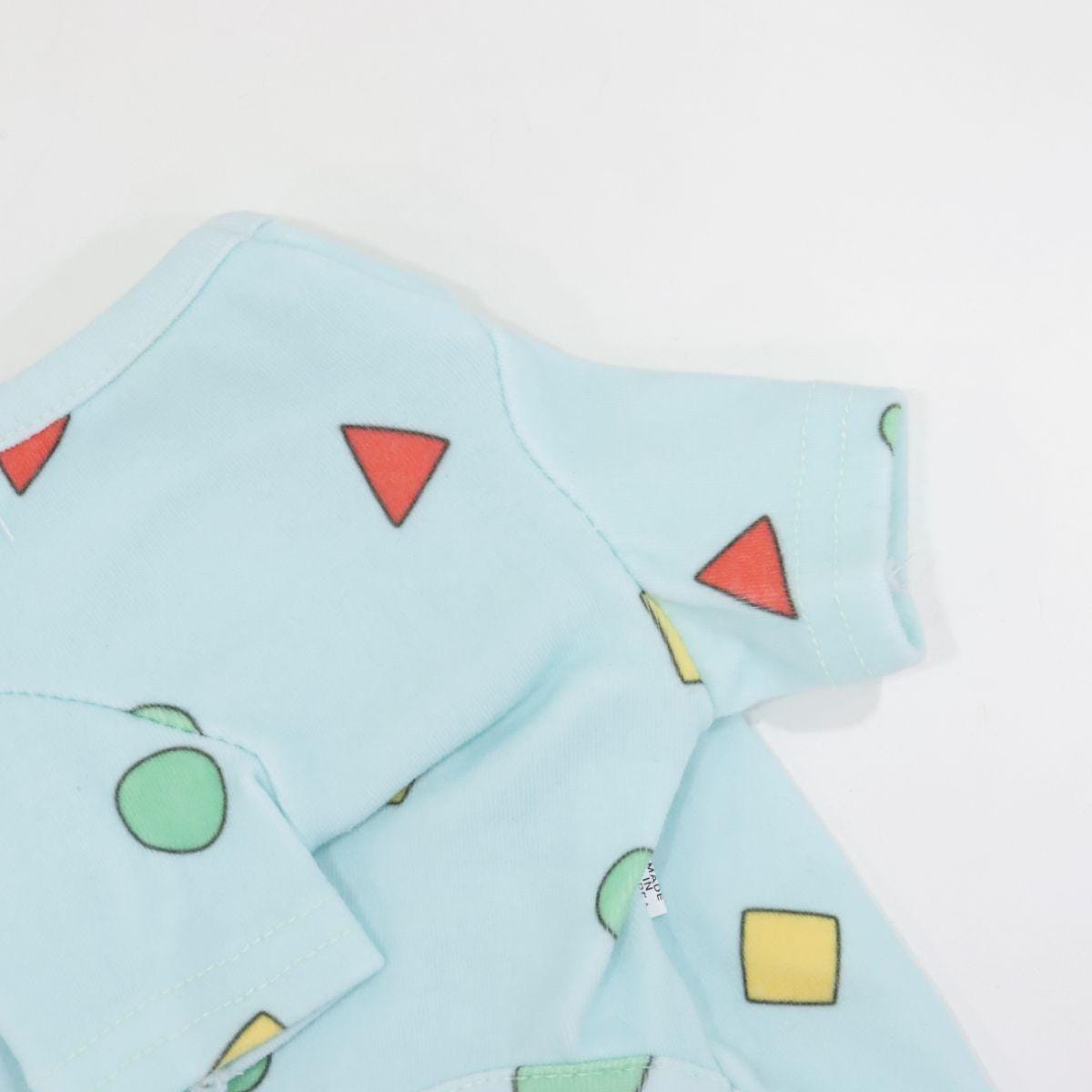 NKpup light blue dog T-shirt featuring a colorful geometric shape pattern.