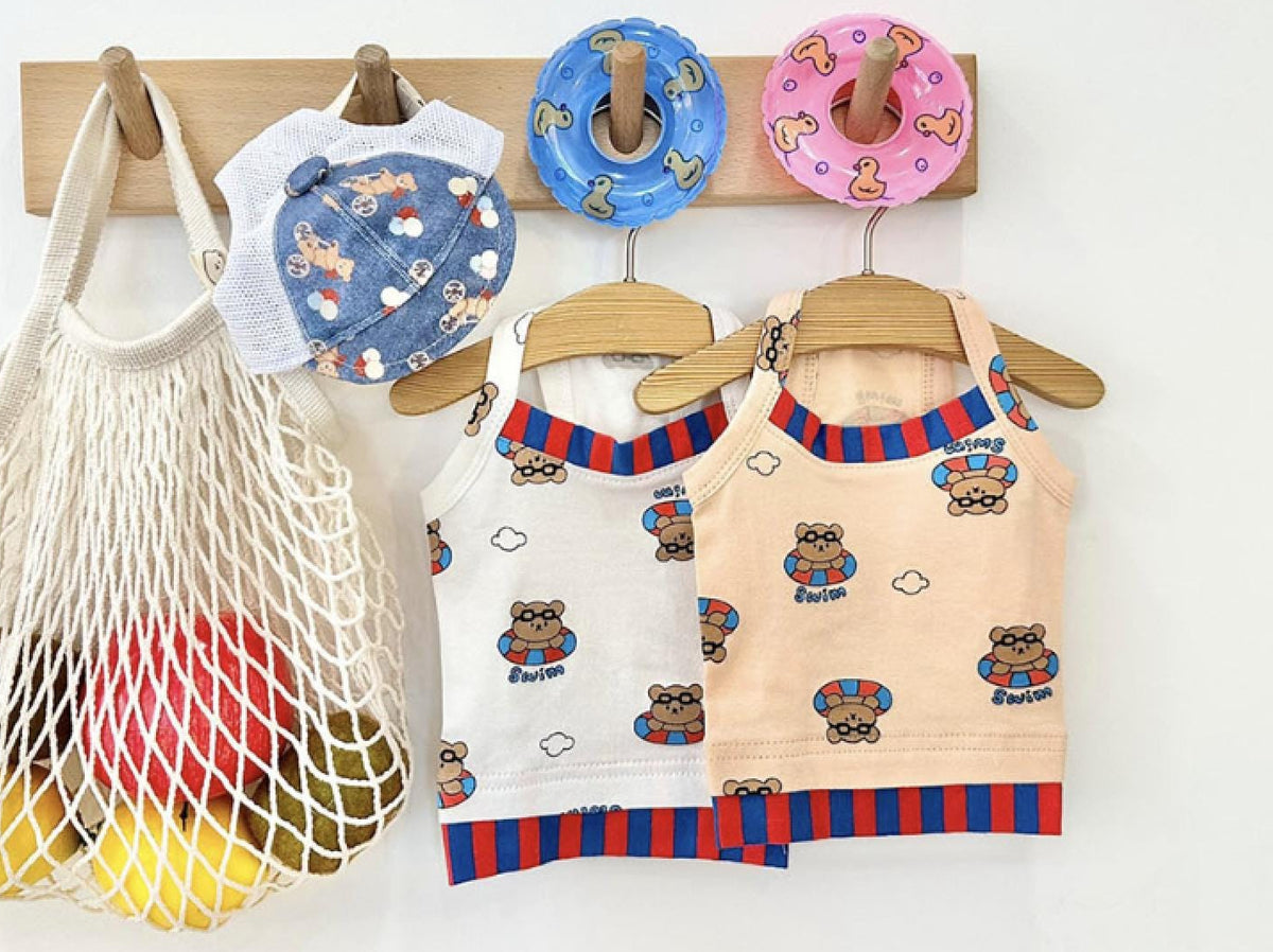 NKpup Teddy Float Tops for dogs in white and peach with teddy bear prints and blue and red stripes.