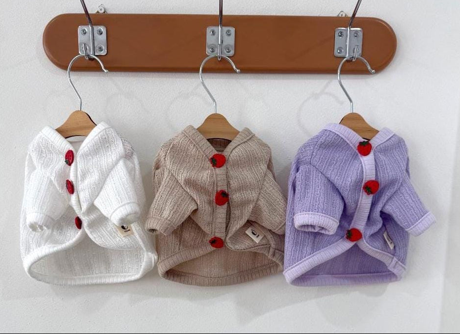 NKpup Strawberry Crop Dog Cardigan in white, beige, and lavender with red strawberry buttons